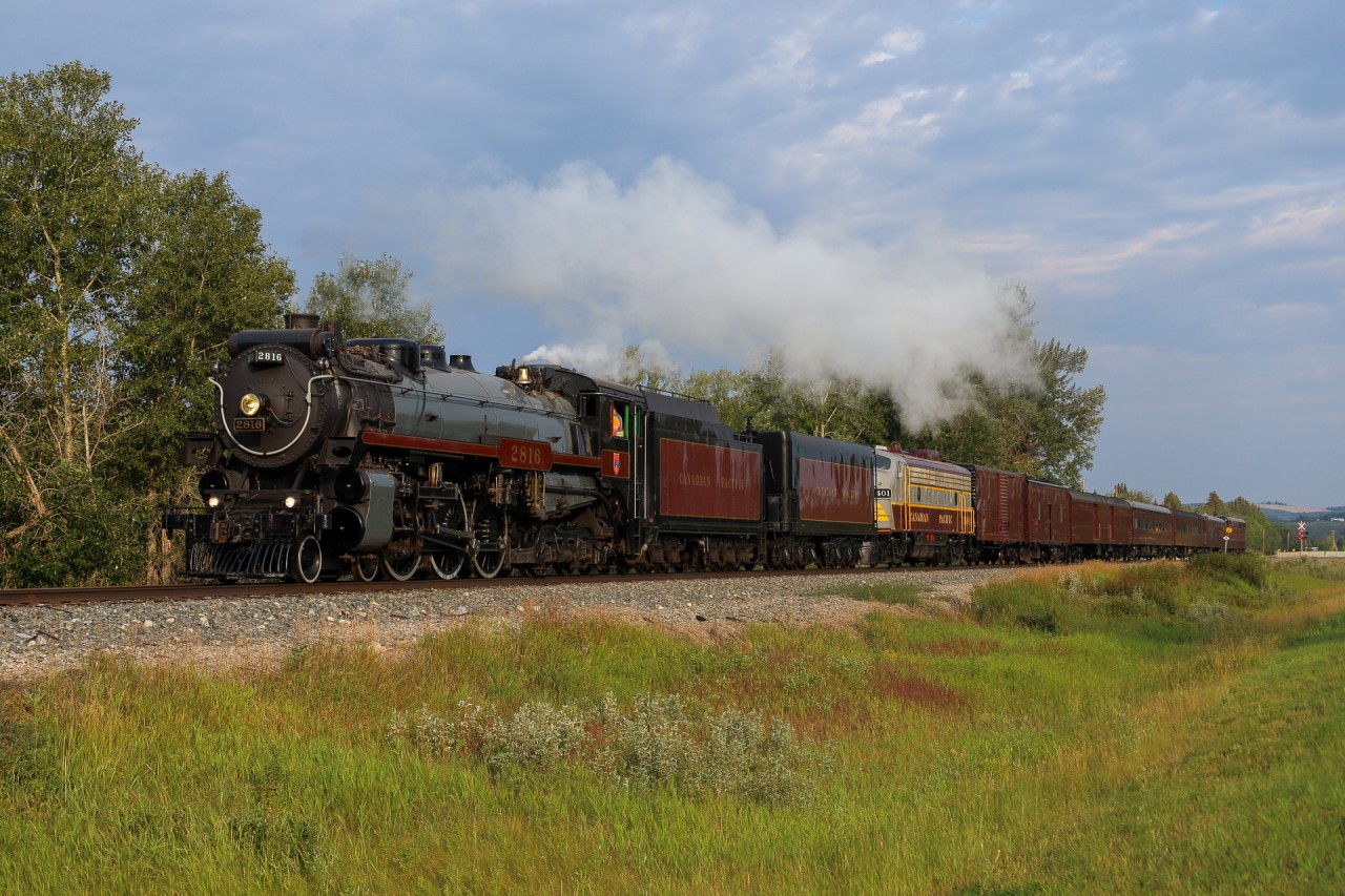 CP 2816 is back on flat ground after navigating the Dewinton Hill and accelerates into Okotoks, Alberta on a break in run to Lethbridge.