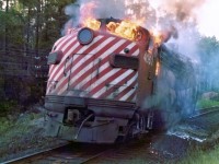 On July 5, 1975 Canadian Pacific FP7 locomotive No. 4062, the third locomotive of westbound Extra 4088 caught fire and was disconnected from the train near mileage 78.5, about two miles east of Franz, Ontario. A Ministry of Natural Resources forest fire suppression crew (including the photographer) was dispatched from Wawa to the scene to prevent the fire from spreading to the adjacent forest.