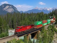 CP 9731 shoves CPKC 112-22 over the Ottertail River, on the aptly named Mountain Subdivision.