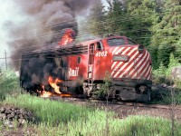 On July 5, 1975 Canadian Pacific FP7 locomotive No. 4062, the third locomotive of westbound Extra 4088 caught fire and was disconnected from the train near mileage 78.5, about two miles east of Franz, Ontario. A Ministry of Natural Resources forest fire suppression crew (including the photographer) was dispatched from Wawa to the scene to prevent the fire from spreading to the adjacent forest.