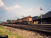 CP 4569 and two other big MLW’s lead a westbound by the Galt, Ontario station on a summer evening on the Galt Subdivision. 