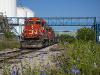 As mentioned in the comments of <a href=http://www.railpictures.ca/?attachment_id=52630>Joe Bishop's recent post,</a> BNSF 2968 was swapped out for another CN GP9RM, 4136, making a nice consist for the triple set.  Here, with cars in tow for Sunrise Metals, the 0700 clears the diamond at Irondale on their way to work industries near Strathearne.