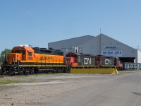 The CN 0700 yard job works at MANA in the core of industrial Hamilton with a pair of CN GP9's and a BNSF GP39-3.