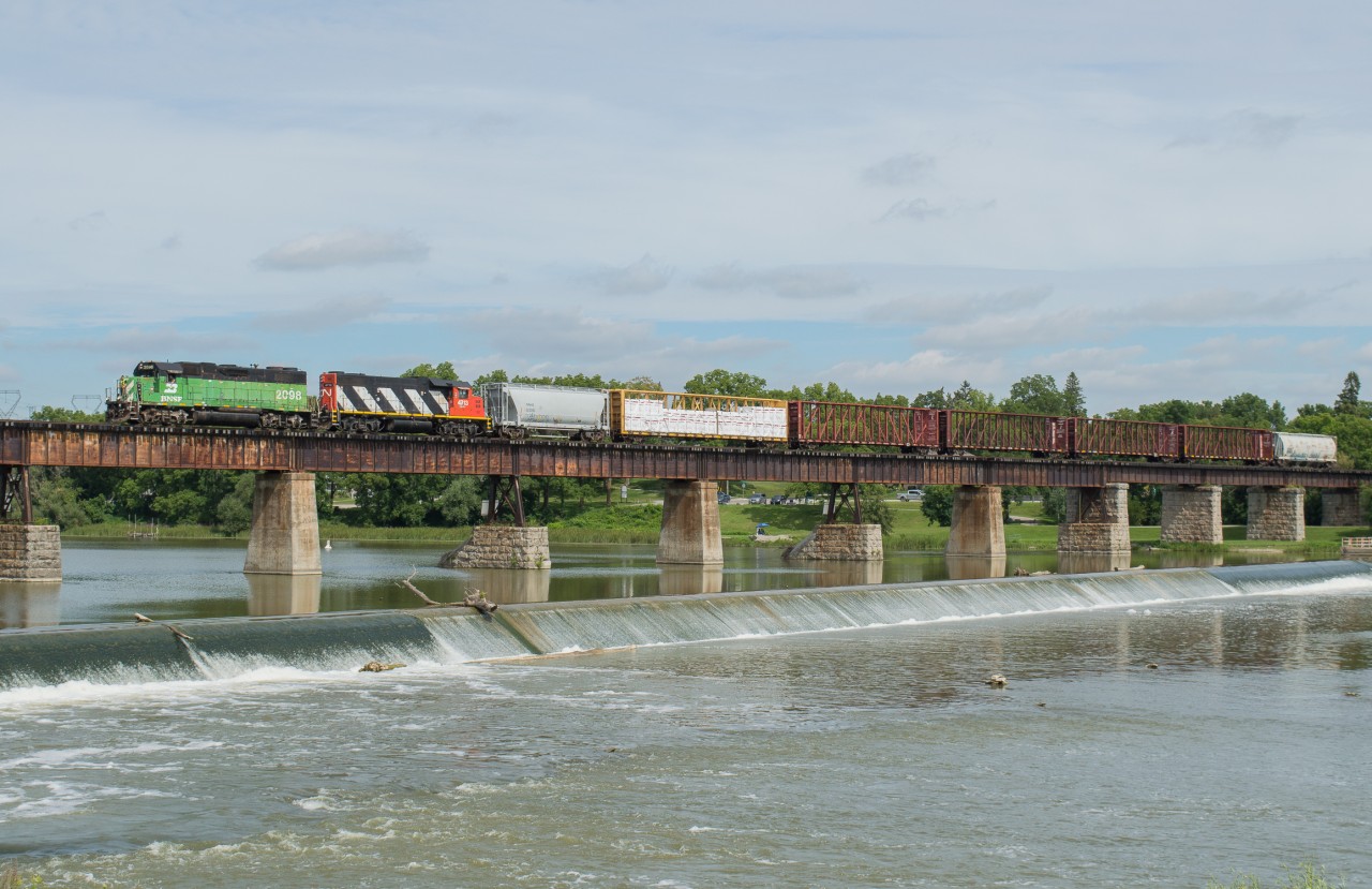 A short CN L580 crosses the Grand River in Caledonia behind BNSF 2098 and CN 4713.  I have photographed a lot of cool engines crossing this bridge in my life but a cascade green GP38-2 is pretty high on the "cool list" alongside a NS GE and two different CN SD40-2W's.