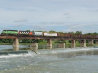A short CN L580 crosses the Grand River in Caledonia behind BNSF 2098 and CN 4713.  I have photographed a lot of cool engines crossing this bridge in my life but a cascade green GP38-2 is pretty high on the "cool list" alongside a NS GE and two different CN SD40-2W's.
