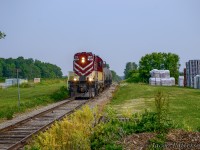 A hazy June morning finds OSR RS18u 182 passing mile 10 of the Tilsonburg Spur just north of Ostrander with tanks for Future Transfer.