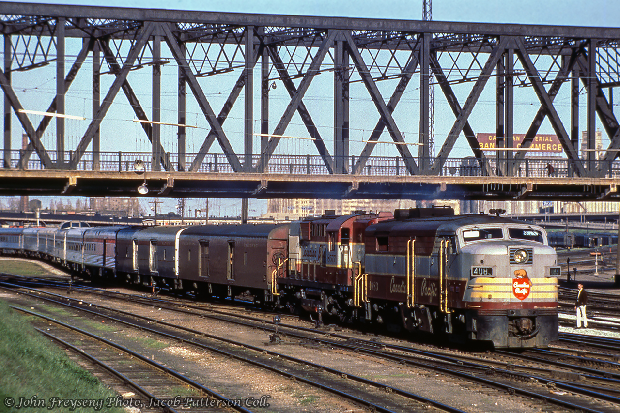 Train number 11, the Toronto - Sudbury section of The Canadian, passes beneath Bathurst Street approaching Cabin D interlocking behind a pair of script-lettered MLW products.Scan and editing by Jacob Patterson.