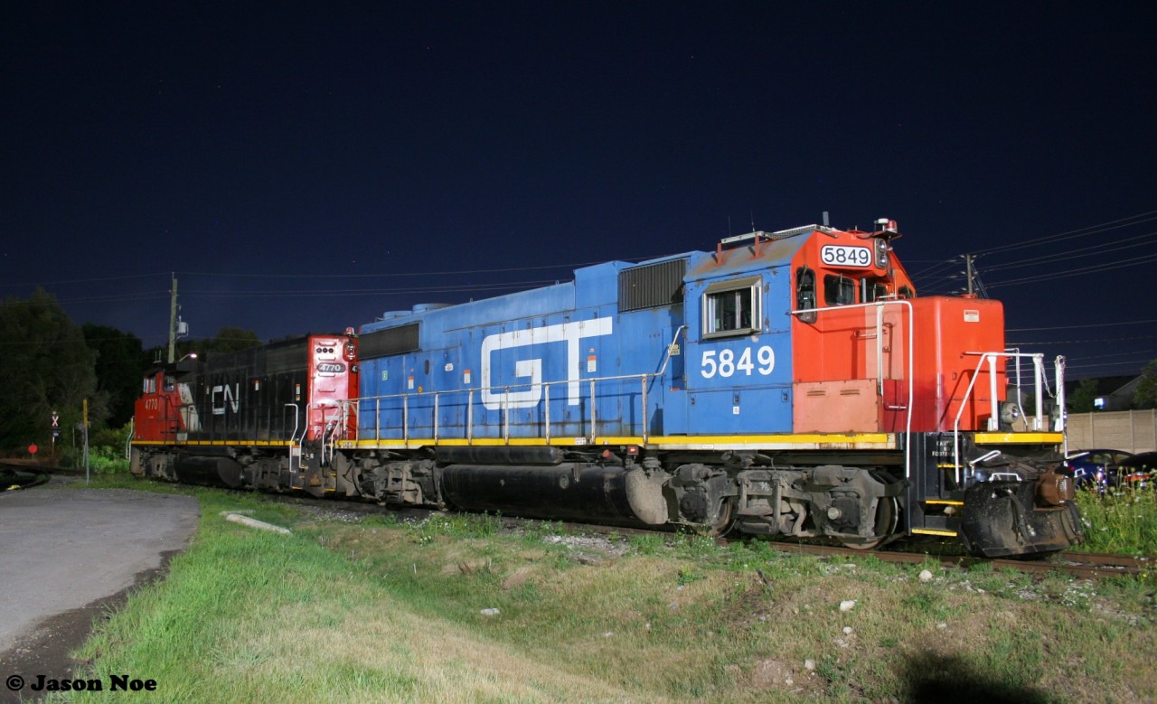 Under a starry sky GTW 5849 and CN 4770 are viewed assigned to CN L542 in Cambridge on the Fergus Spur. In fall 2022, this assignment’s origin was changed from Cambridge to Kitchener.