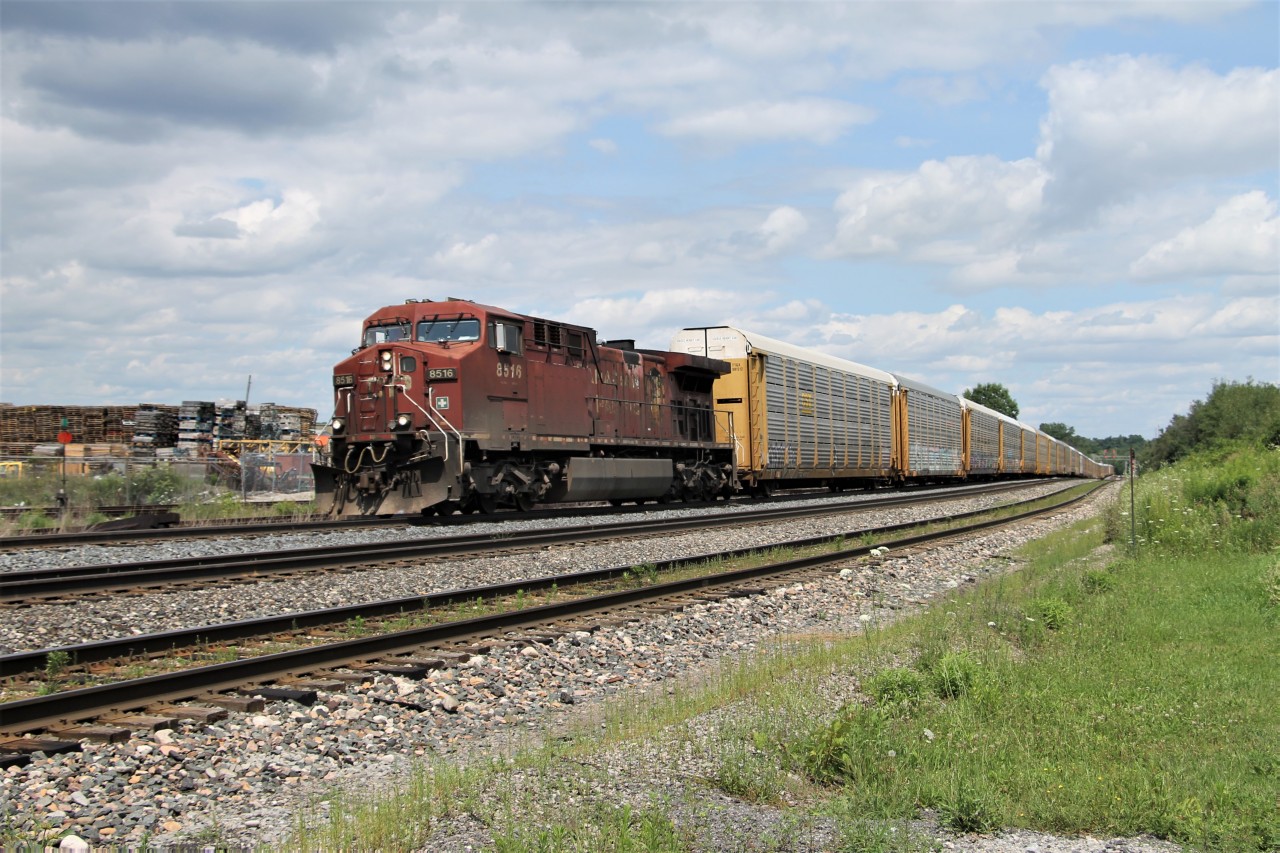 CP 8516 is working hard up the grade through Guelph Jct. with a solid train of tri's.