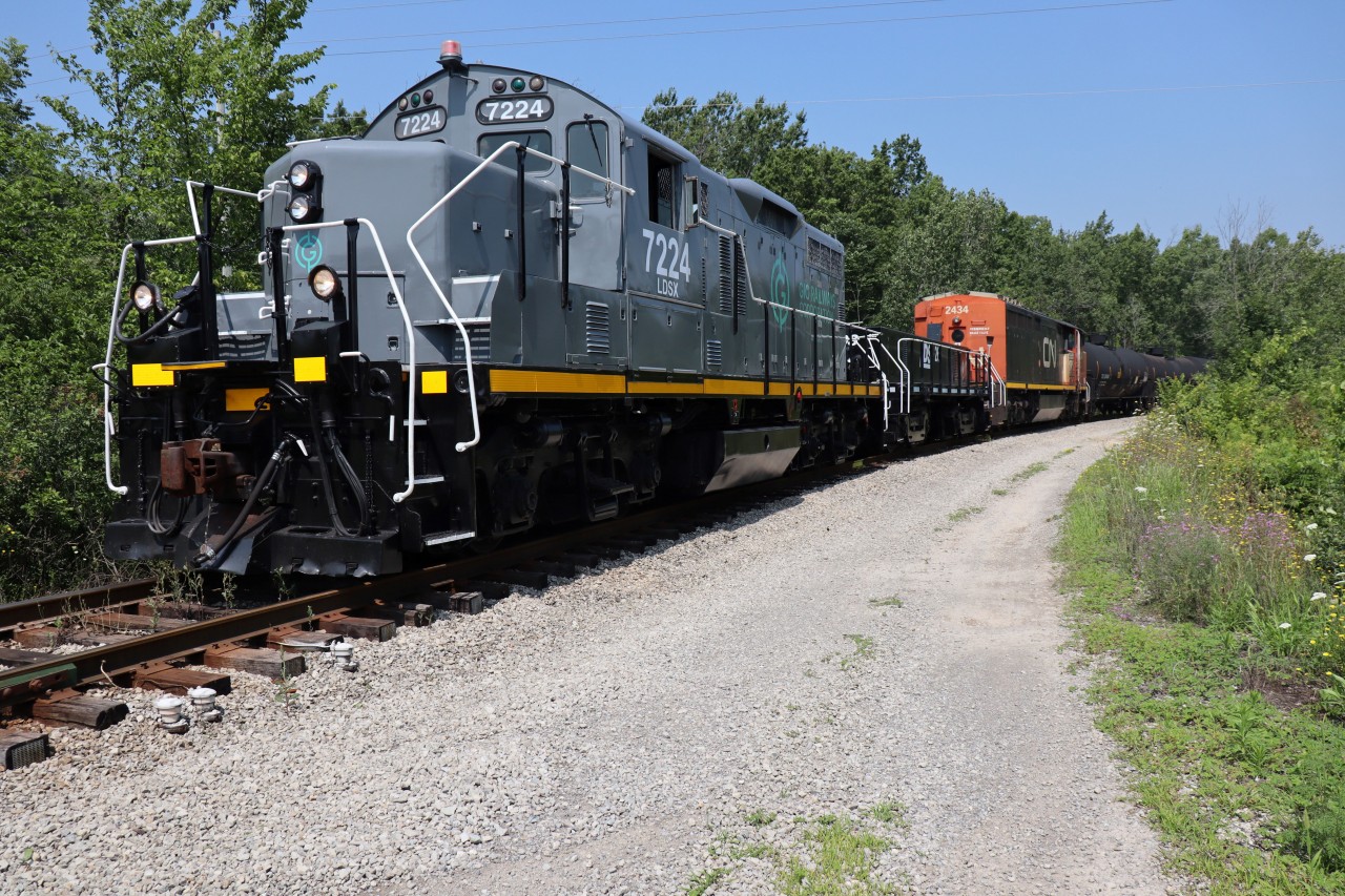 LDSX 7224 with slug LDSX 269 exits Feeder Yard ( Feeder Rd E MP: 0.16) with the retired Dash 8 CN 2434 (part of the infamous July funeral train) and a large cut of tank cars for Verbio Diesel Canada. After servicing Verbio, CN 2434 would be delived to SLM Recycling, Welland joining several other retirees already spotted on the adjoining track, immediately outside of the SLM compound plus a BC unit on the inner track.  Now with JLCX seemingly positioned in the back pasture, LDSX 7224 and 269 should take on regular duties along with the more experienced Alco 1859.