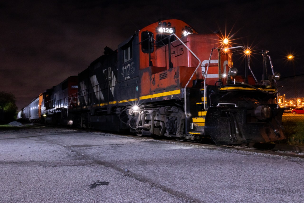 The glory days of the lowly CN GECO spur may be gone (after the GM van assembly plant closed in the 90s) but CN 546 still traverses it twice a week. On this night, CN L546 was stopped at IPEX while the conductor threw a switch in the middle of their duties there. CN 4125 and CN 4776 spot 1 car and pull another out. CN 4125 is the oldest active locomotive on CN (built 2/1955) and I am extremely thankful for every opportunity I have to shoot this unit.