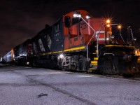The glory days of the lowly CN GECO spur may be gone (after the GM van assembly plant closed in the 90s) but CN 546 still traverses it twice a week. On this night, CN L546 was stopped at IPEX while the conductor threw a switch in the middle of their duties there. CN 4125 and CN 4776 spot 1 car and pull another out. CN 4125 is the oldest active locomotive on CN (built 2/1955) and I am extremely thankful for every opportunity I have to shoot this unit. 