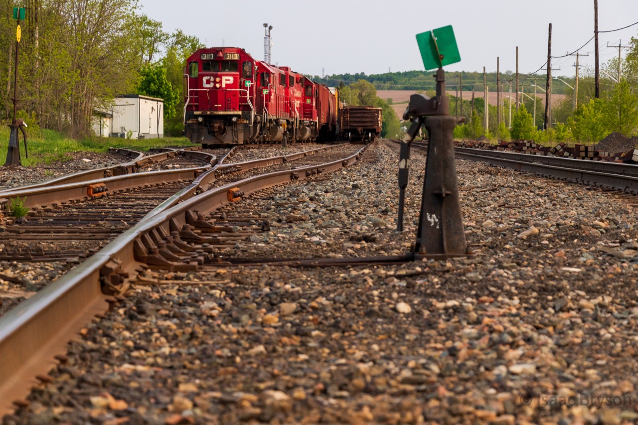 Rare mileage... sort of. Earlier in the day, CP H88 eastbound left a cut of manifest on the OSR connecting track at Woodstock anticipating a pickup by the shortline later in the day. By the time they returned westbound, OSR had not showed and a foreman needed the track clear to move MOW equipment out of Woodstock. CP H88 hooked back onto the cut they left behind and shoved it into the OSR yard so that a track was clear for the foreman. It's pretty uncommon to see CP on those tracks so it was worth a few shots despite the smoky skies blocking out the sun.