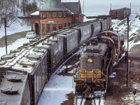A late winter snow gingerly falls upon the CPR Goderich wayfreight, paused beneath the tell tails while the power is prepared for departure.  MLW RS3 8456 would be retired in 1983 and scrapped, while SW1200RS 8154, rebuilt to CP 1241 in 1982, would be sold to Independent Locomotive Services of Minnesota in 2012 as ILSX 932.<br><br><i>Scan and editing by Jacob Patterson.</i>
