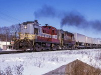 With TOFC traffic on the head end, a pair of first generation MLW products throttle up departing Belleville westbound for Toronto.<br><br><i>Scan and editing by Jacob Patterson.</i>