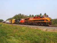 What could have been if the merger went the other way...  M 35651 18 rolls through Stony Plain with KCSM 4752 and CN 5624.