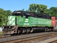 It's hard to believe that BNSF 2098 has been assigned to Brantford for almost three months.  Expecting it wouldn't be around long, on it's second day in Brantford I chased it to Hagersville and back on a rather soggy day.  Clearly, I didn't have to.  Originally paired with CN 9547, CN 4713 came and went, now it's working with CN 4791.  By now, I'm sure nearly every railfan in Southern Ontario has gotten a photograph of it. Railfans from several States have also made the trek to Brantford to photograph the cascade green BNSF. My first photo of BNSF 2098 was on June 8 pulling out of yard trailing on CN 581, so I thought it was fitting to upload a considerably better photo of it doing exactly the same thing in much nicer conditions.  