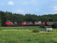 Ram River, Alberta to Vancouver Thornton Yard, BC sulphur train S 71351 06 rolls through Looma, Alberta on the Camrose Sub.  Due to a shortage of power, the SD40-2Ws have been sporadically seeing more mainline time and today 713 has CN 2951, CN 5321 and CN 5268.  The SD's were supposed to lead the train back, however, due to the 5268 not having dynamic brakes, the power had to be ran from the mine at Ram River back to Red Deer to wye, before being able to bring the train down the mountain grade from Ram River, which is nestled in the foothills of Alberta.