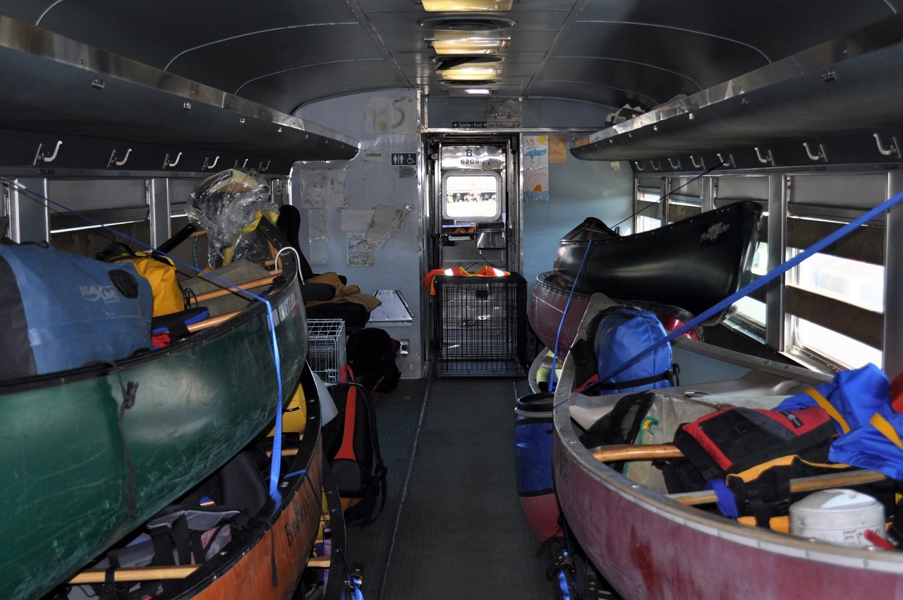 VIA 6205's interior on this date holds 8 canoes and supplies instead of passengers.
