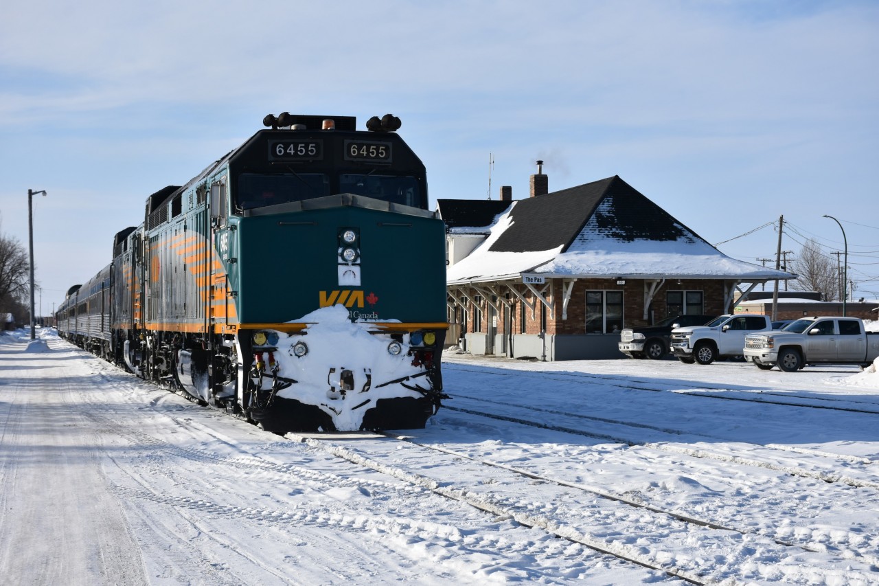 With the recent heat wave experienced in Ontario this past week or so, I thought I'd post something on the cooler side from March of this year. 
VIA 691, with VIA 6455 on the point is idling away on a yard track in front of the station in The Pas, MB on a very cold March 16, 2023 morning. 
KRC's train 291 The Pukatawagan Mixed will soon be made up in front of the station, but the VIA equipment will continue to spend a few more hours in The Pas before making its way north to Churchill, MB later in the day.