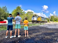 Another one for the time machine: 3 brothers look on as VIA #2 arrives in Washago to make one final stop, before arriving in Toronto.  To see the same boys and location 5 years earlier: http://www.railpictures.ca/?attachment_id=34160