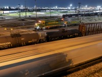 What else do you do on a Friday night but wander Mac yard?

After seeing the heritage set works the visible end of the yard, I decided to walk up and watch it in action. The RC set making several stops in close range giving chance to grab a few shots of the elusive pair wearing CN's original green and gold.
