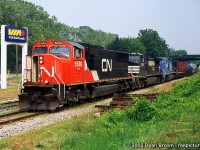 Captured: 334 with CN SD75I 5690, NS C40-9W 9236, and PRR C40-8W 8383 at Mile 11.8 (St. Catharines) on the CN Grimsby Sub at 15:30 on July 7/2002.