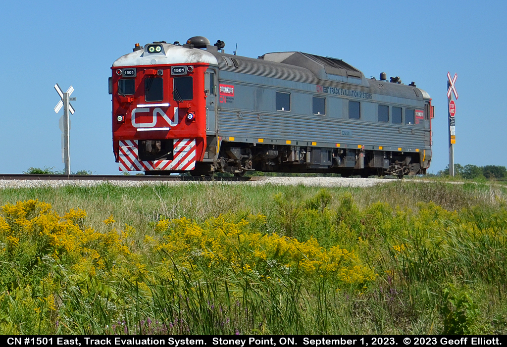 Testing.... 1, 2, 3.  Testing....  CN 'Test Track Evaluation System' car #1501 heads westbound along the VIA Chatham Subdivision while occupying the farm crossing at MP 83.46.  CN 1501 was originally a CN RDC-1, numbered D-108 when built in 1958 for passenger service.  CN renumber the car to CN 6108 in March 1969 and it later became VIA 6108 in March 1978. CN later acquired it from VIA but it was rebuilt into a rail test vehicle and was in service as CN 15016 in 2010. From what I have read it was quickly renumbered to CN 1501 due to CN's dispatching software only accepting four digit numbers for a locomotives.