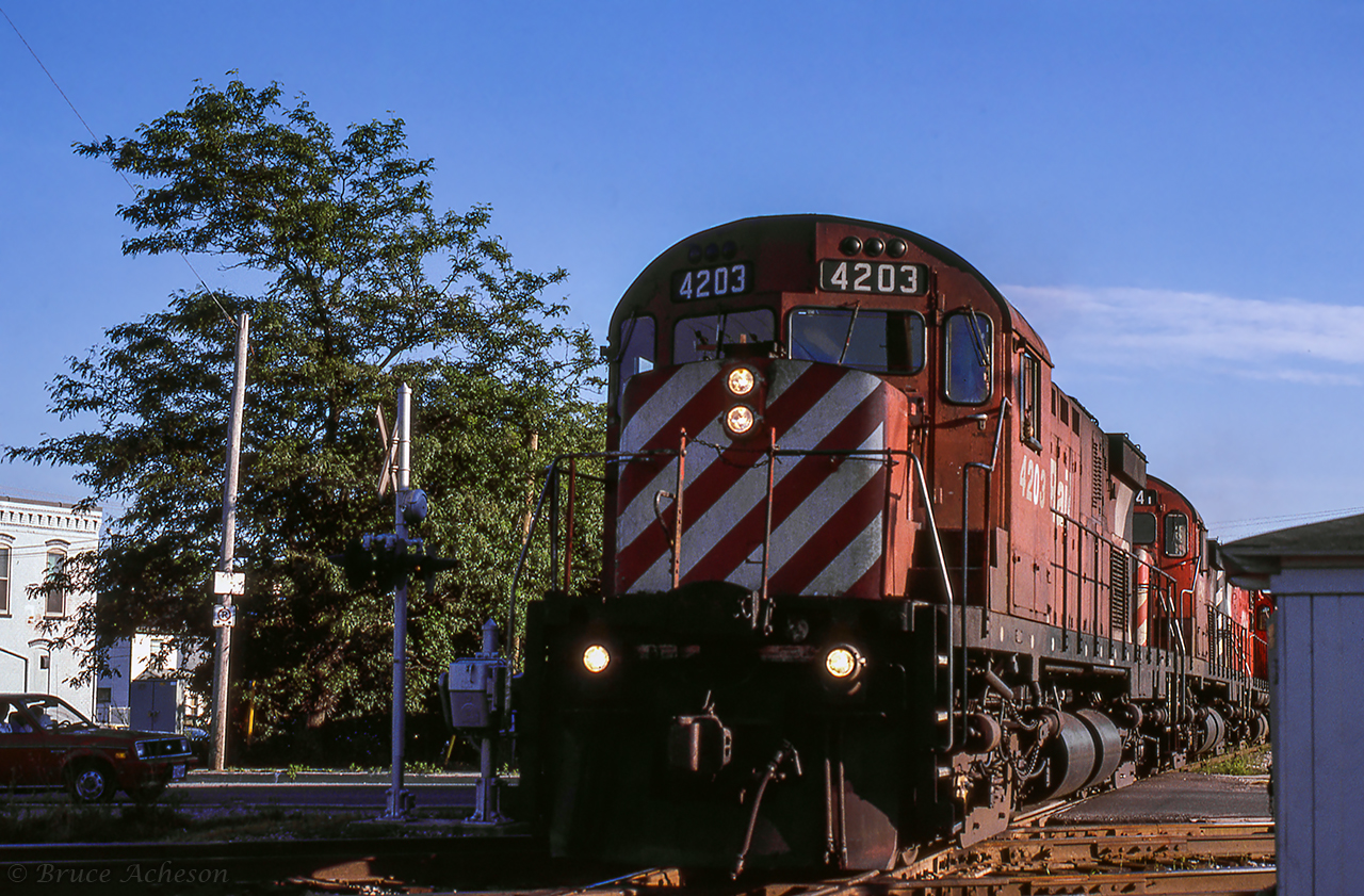 CP's Nanticoke steel train crosses King Street, pounding the diamond with the CASO sub at Hagersville.  Once clear of the yard, the train will reverse through the sidings, into the CN/CASO interchange tracks, then onto the CASO for the eastbound run to Welland.Earlier shots of this train:Approaching GarnetBoth CN/CP steel train meet at Garnet