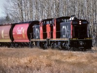 By the looks of the exhaust, the south switch of the connecting track has been lined back to normal and 584 is getting underway. These 2 are a good pair, both have the old style numerals in the number boards. This photo taken by mile 36, time 11:40.