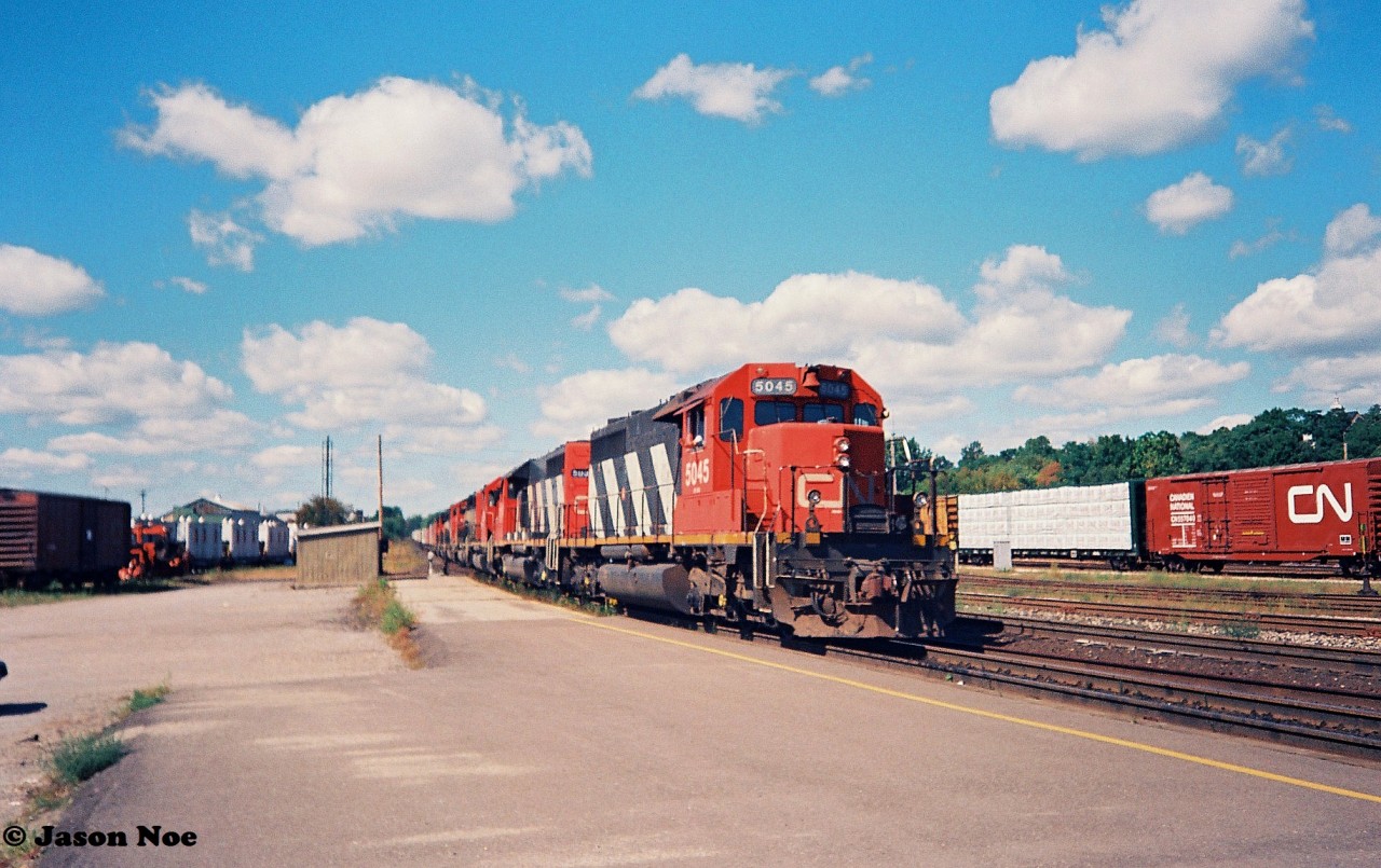 During my very first visit to Brantford, Ontario with my dad, I photographed what was likely CN laser train #238 passing the station with a friendly wave from the engineer of SD40 5045 that led six other units.