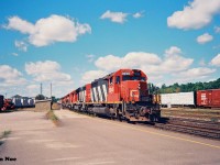 During my very first visit to Brantford, Ontario with my dad, I photographed what was likely CN laser train #238 passing the station with a friendly wave from the engineer of SD40 5045 that led six other units.