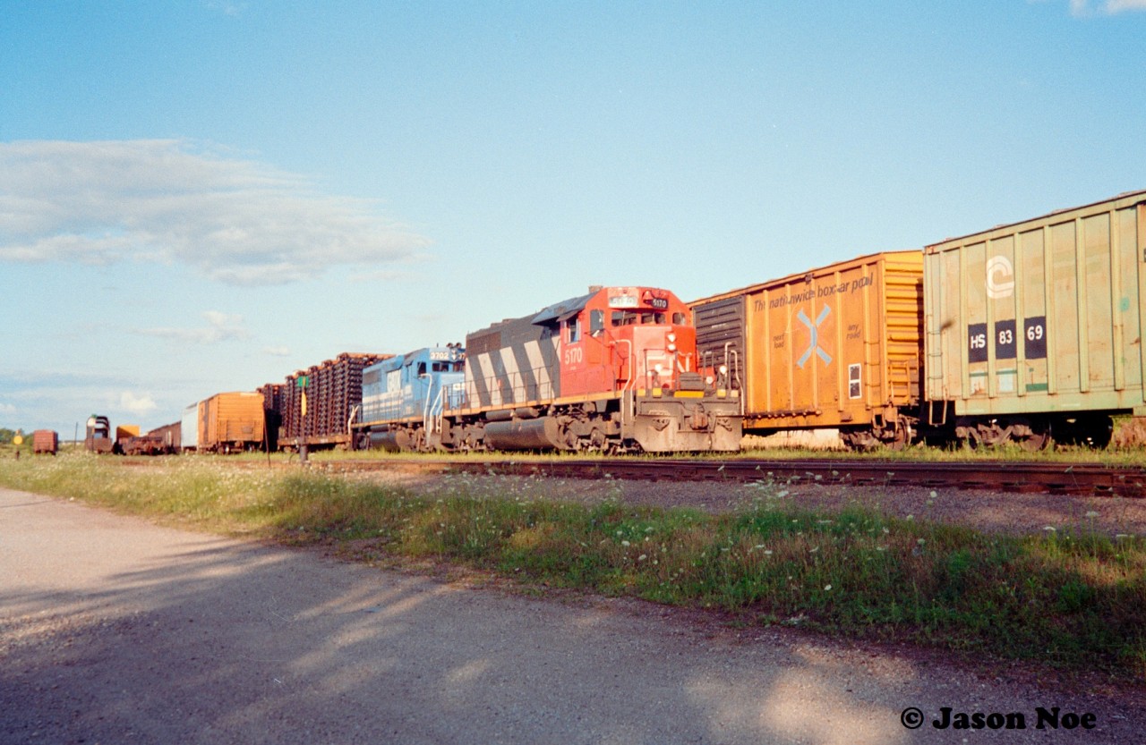 CN 421 is seen lifting the loaded frame flats at the Kitchener yard with CN 5170 and GATX 3702. The train had set-off the boxcars to the right of power, which were likely for the Cottrell warehouse to be delivered by the 23:00 CN Kitchener Job.