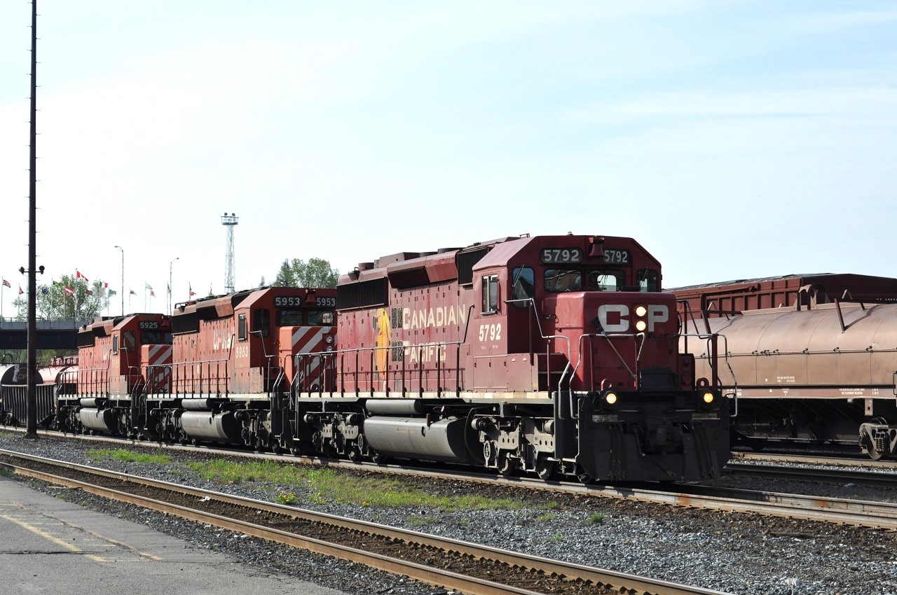 A trio of "Good Old Girls" SD40-2s, 5792, 5953, and 5925 lead a westbound freight over brand new rail into Sudbury, Ontario on May 21, 2011 where they will do a small set off and lift.