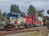 DH 7304 and CP 5015 split the MP 112.9 signals with a train of head-end intermodal well cars followed by grain hoppers, at location Westwood in Coquitlam BC.<br>
The train is westbound (compass north-west) out of Port Coquitlam Yard on the CP Cascade sub, heading toward the Burrard Inlet container terminals and grain elevators near downtown Vancouver.<br><br>
Westwood (Street) is the northwest control point of the wye where CP Westminster sub (at right) joins the Cascade sub.