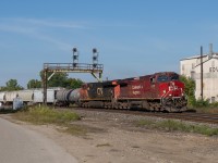 CN 394 passes through Paris Ontario behind CP 8157 and CN 2938 on a sunny September morning.