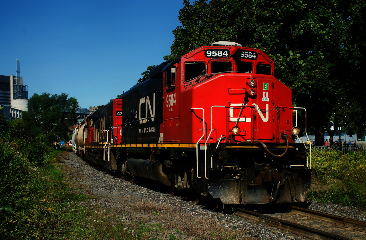CN 9584 looks sharp as it leads a short transfer out of the Port of Montreal just a few minutes ahead of CN 100's light power.