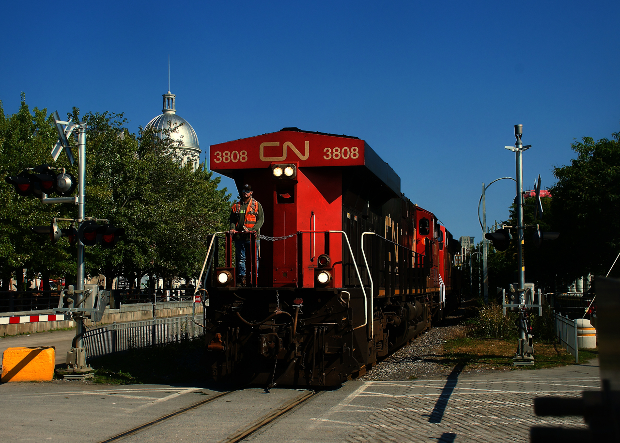 After bringing a grain train into the Port of Montreal, CN 878's light power is heading back to the mainline long hood forward.