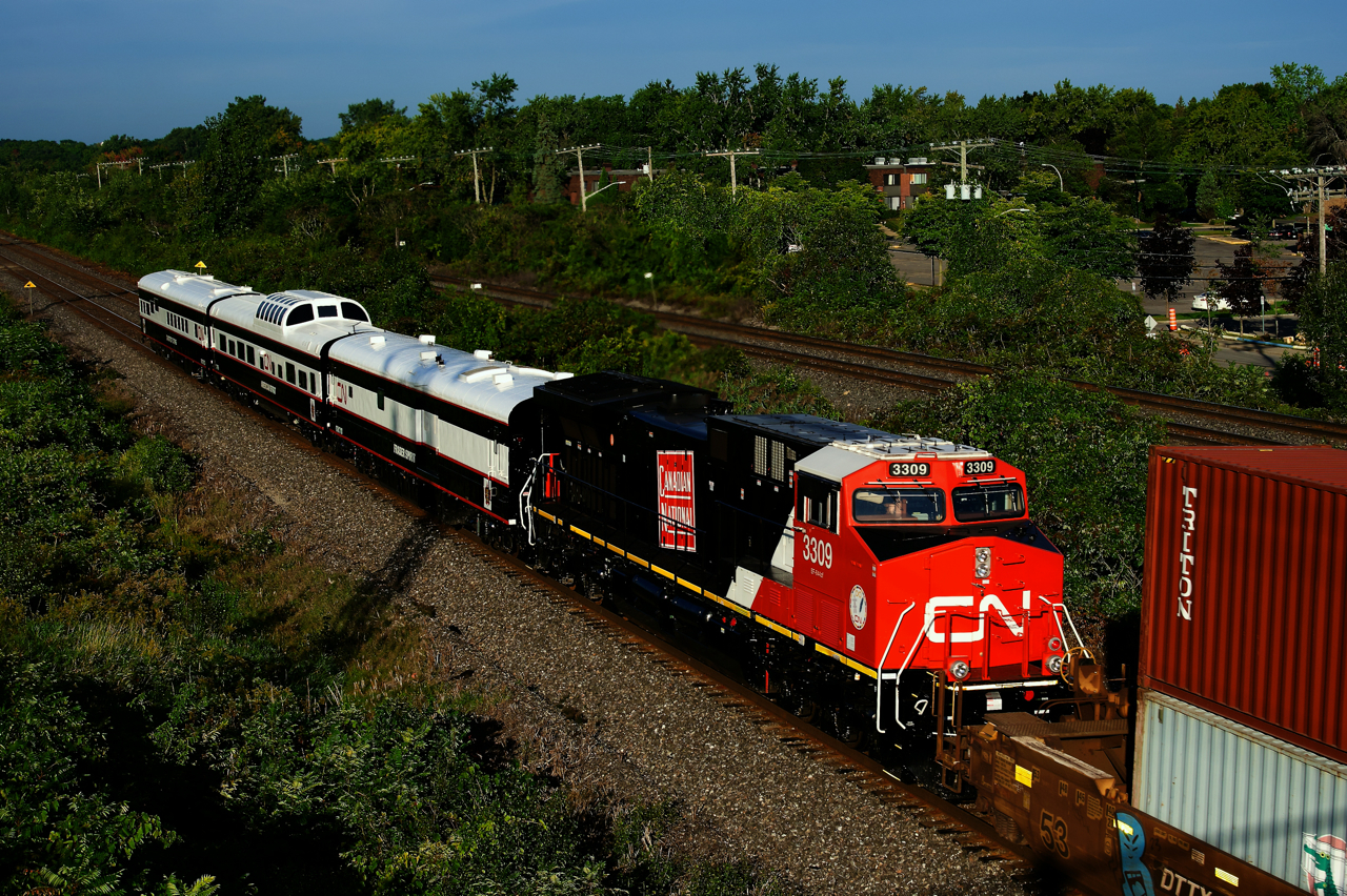 CN 3309 has recently had a vintage CN logo added to its long hood. Here it is on the tail end of CN 120, along with three business cars. CN 3309 and the business cars were on their way to Halifax.