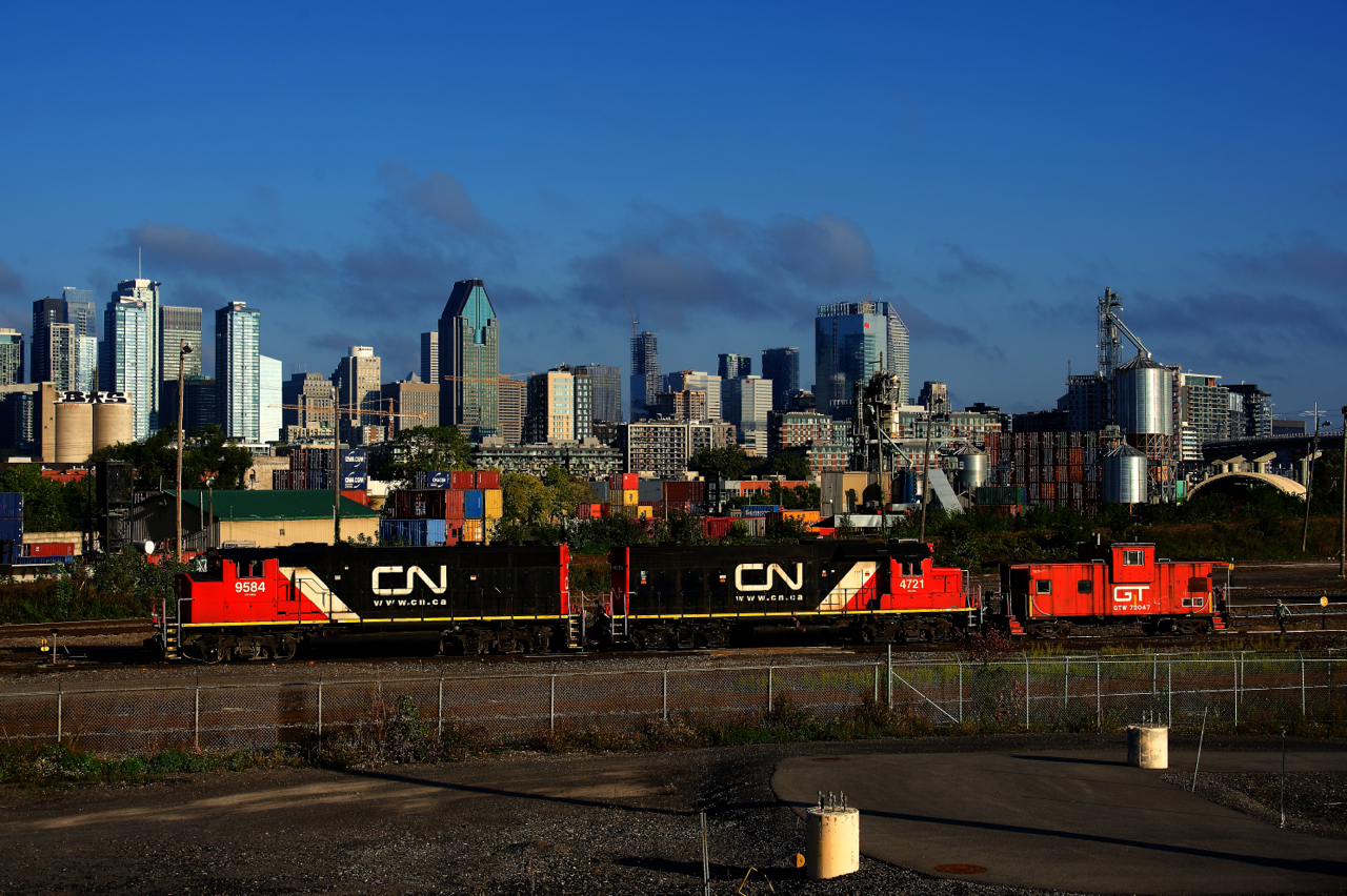 The Pointe St-Charles Switcher works their namesake yard with a GTW caboose in tow.