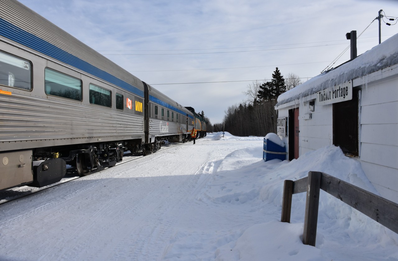 After a brief stop to unload groceries and other essential supplies, a yell from the second engineer is my signal to climb back on board VIA #693 The Hudson Bay at HBR Thicket Portage, MB Mile 185.0 Hudson Bay Railway Thicket Sub. on March 13, 2023. 
And yes, it is as cold as it looks! Brrr!