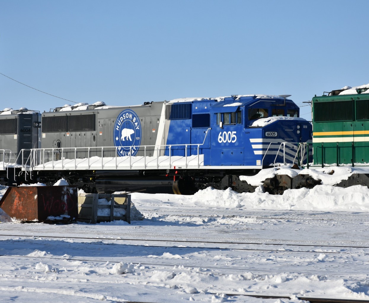 HBRY 6005 SD60M (ex-UP) sits sandwiched between HBRY 6004 & HBRY 5005 at HBR's The Pas, MB diesel shop yard on a sunny but bitterly cold March 16, 2023.