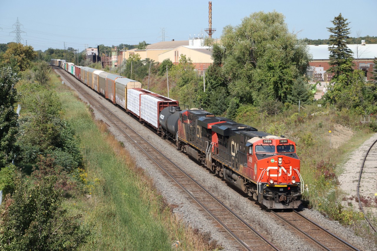 CN 3898 and CN 38xx lead a westbound train stretching back through Tansley across the single track 12 Mile Creek Trestle. The head-end is about to pass under the recently opened first phase of the Dundas St. bridge widening project over the Halton Sub. that includes a nice wide sidewalk which I am taking advantage of today.
