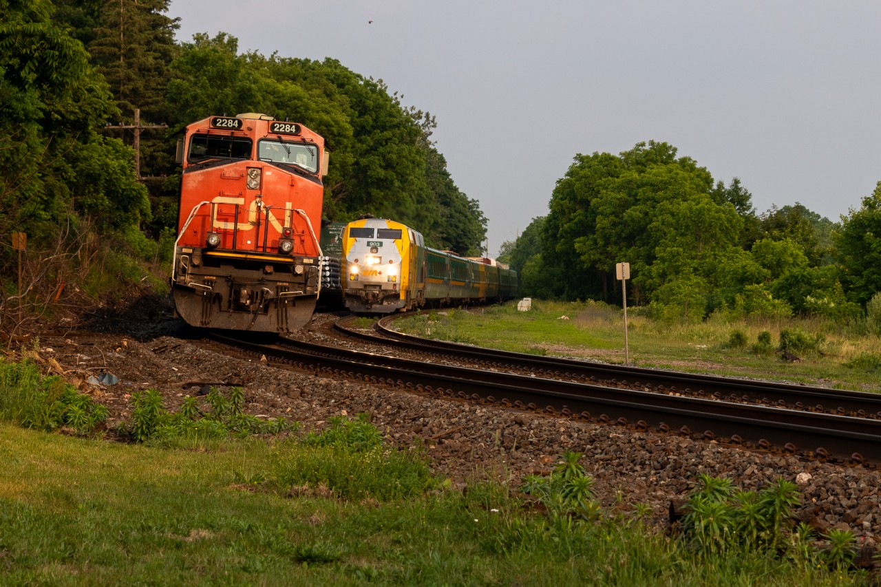 VIA 75 winds through Paris ON, overtaking a tied down CN 301 in the process. VIA 903, a wrapped P42DC provides the power, pulling 6 LRC coaches. ES44DC 2284 is CN 301s leader, who would get a rescue crew about a few hours later.