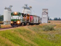 Shooting GWRS in the summer is far from ideal, as high summer temperatures often restrict shortline operations and grain traffic is generally at its driest. This short and overpowered weekly run back in July demonstrated this well, as it was outbound from Assiniboia as early as 2am, and would finish working Neville and tie down by roughly 7am. This was uncharted territory for me, and I miscalculated that they would have work along the way to Neville, so after detouring to each siding up to about halfway without any sign of them, I quickly realized they would soon be at their terminus, and I narrowly beat them to Neville by only about 3 minutes. On point is one of GWRS' newest acquisitions of 4-axle power; 577 was one of two ex-Conrail B40-8s purchased from GECX in 2021 and got a fresh coat of GWRS paint added prior to delivery. Trailing is an ex-ATSF B40-8W still in BNSF H2 paint.