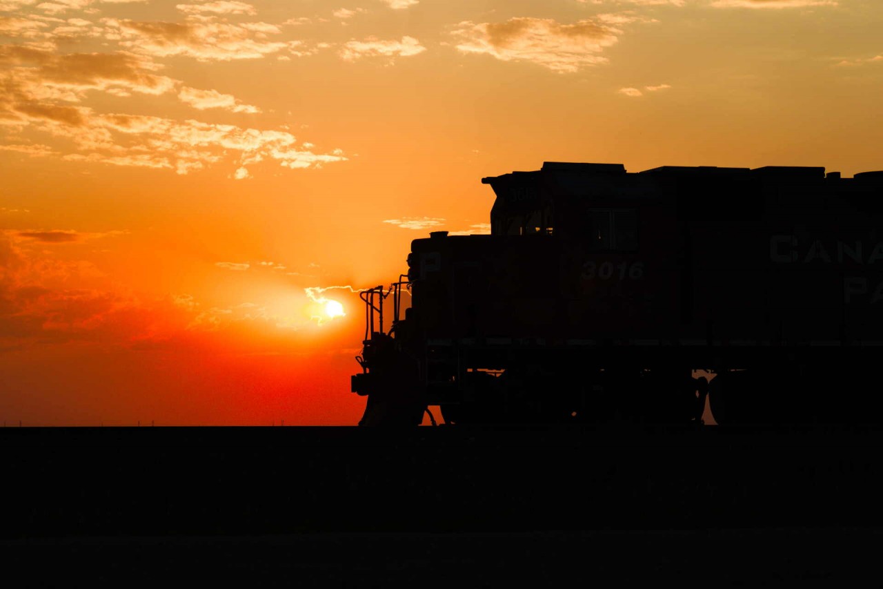 CP 3016 on the point of E37 outlaws a second crew after much work in the Mosaic Potash Belle Plaine, since starting the day prior. I stayed with the skeleton of this tied-down local to watch the sunset fade into the late-August smoke-filled skies that persisted all summer. This GP38AC wandered into Saskatchewan in early summer and surprised me to see it in active service, given its rare breed of AC power and retaining class light specs, so this shot satisfied my subtle eagerness to catch it.