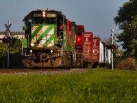 I may have been late to the show for this green bean nestled in Ontario, but it's still running out of Brantford and has thus far survived enough rounds of power swaps that it begs the question of when CN will do its overdue 90-day inspection. Its partner is now 4791, and this particular run on Labor Day was unusually late, departing Brantford after 9am, had a lengthy lunch break in Hagersville, and did almost 2 hours of work at CGC. They only got into Caledonia on their northbound leg after 4:30 pm, and the crew being over 10 hours on the job, could often result in a tie-down for safekeeping. Fortunately, L581 relieved the train and would take on the responsibility of bringing L580's train back to Brantford. The low-level lighting here perfectly highlights how late they were as they began entering the outskirts of Brantford in the neighborhood of Cainsville at around 6.