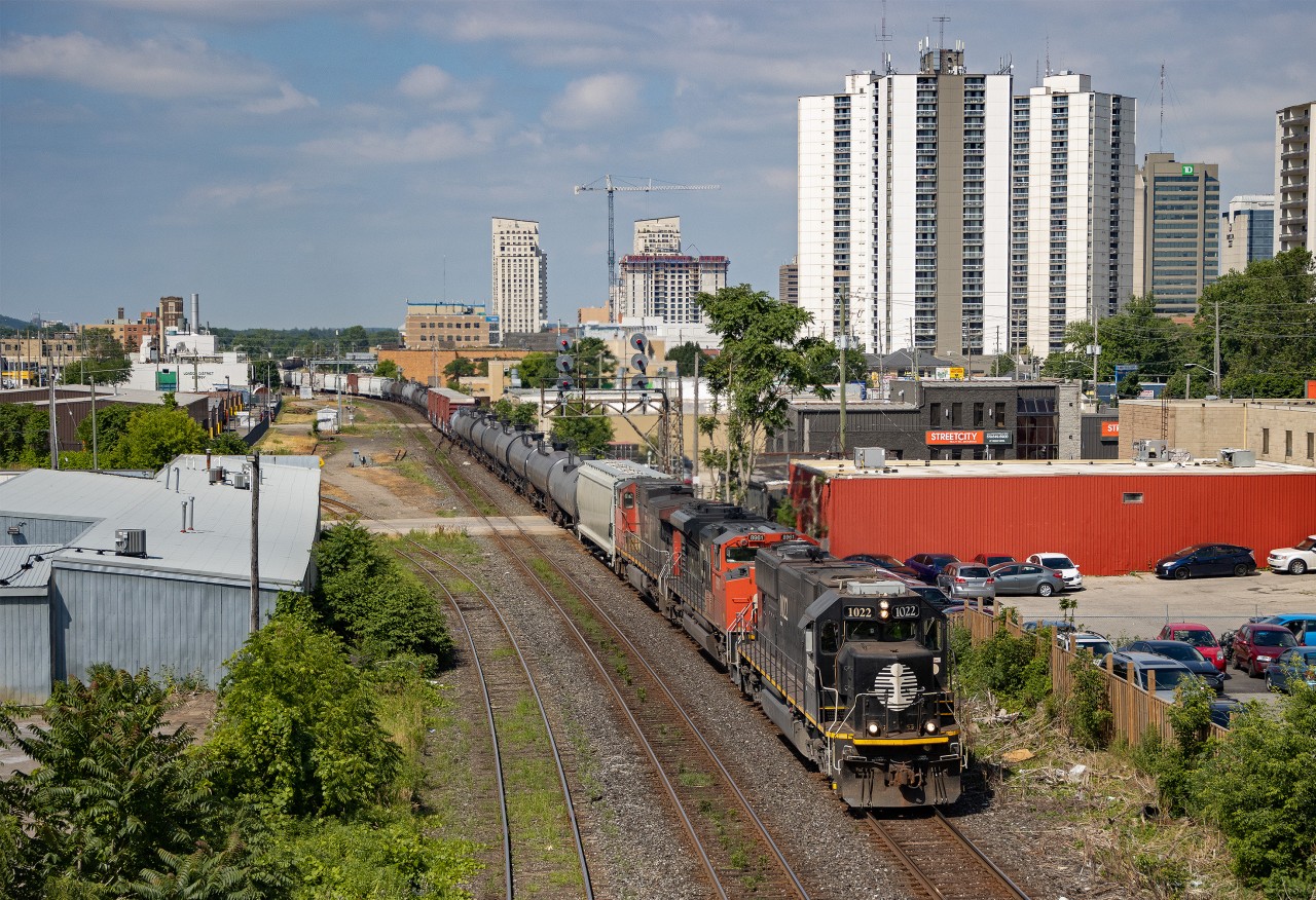 July 7, 2022 - Illinois Central SD70, built in 1992, leads CN 396 eastbound through London, Ontario.  I have only ever seen two SD70s lead, this being one of them.  The old searchlight signals still standing throughout London have always made for interesting additional subject matter.  The IC 'Deathstar' paint scheme has always stood out to me as being especially sharp.  A great example of being simple, but effective.