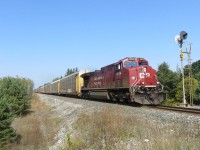 With auto racks on the front ahead of intermodal and 8654 mid train, 8054 passes the signal at Midhurst. 