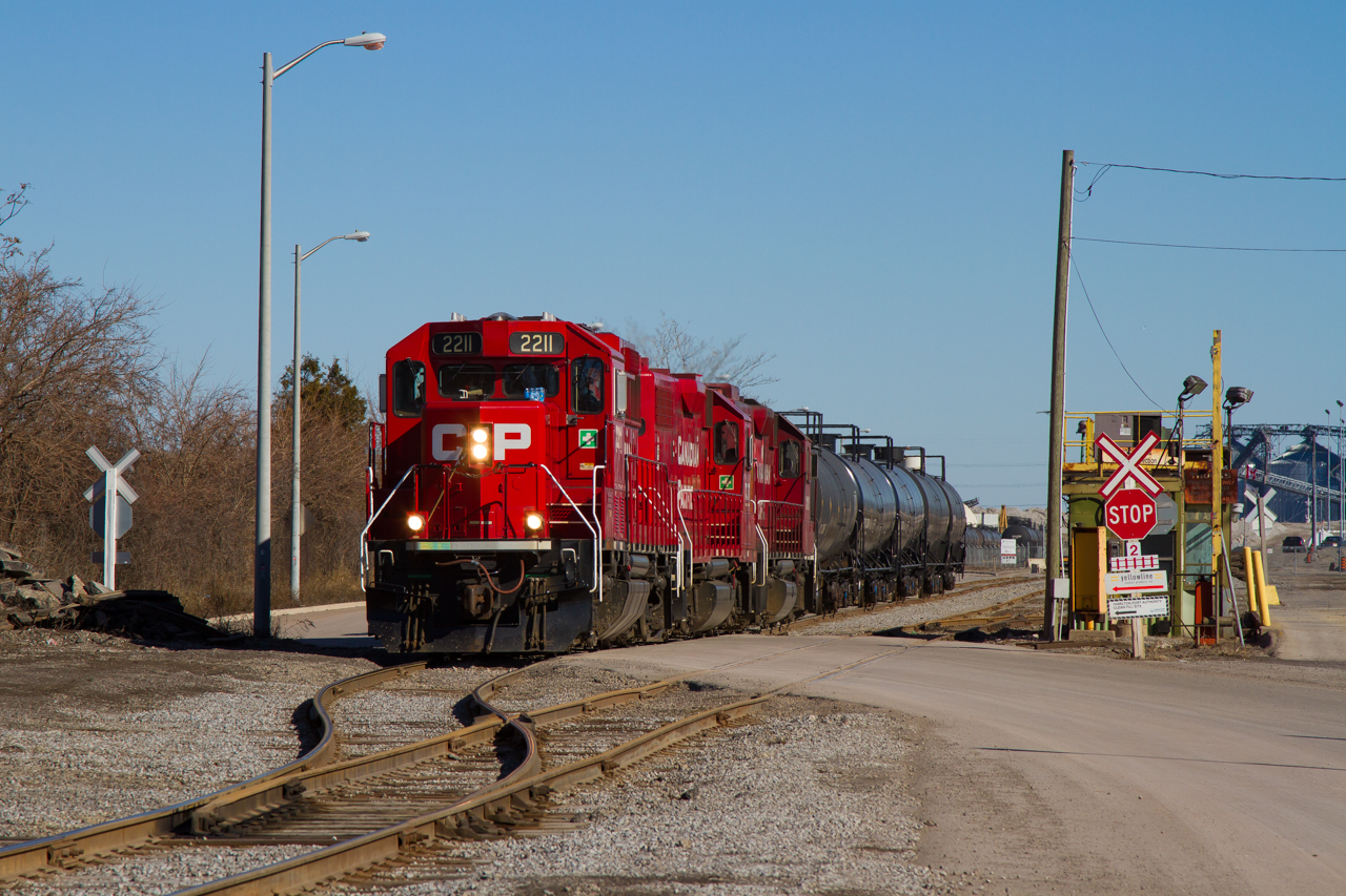 A trio of Canadian Pacific units are pulling a cut of tanks from Yellowline (I believe) passing by the location of the former Stelco Rod Mill. As discussed many times on this site, the green shack just north-east of the crossing is the former Stelco Guard Shack. The area has changed a ton, but at least rail service still remains. If you haven't seen it already, Jason Noe has quite a photo from this location back in the 90's, and gives a great perspective on how much has came and gone from then to now. Worth a look if you haven't already.


As for the operations here, I believe this is TH41 based on older images and info I've gathered. However, being five years ago, and me not venturing into Hamilton very often, corrections and advice are always welcome as I may be wrong.